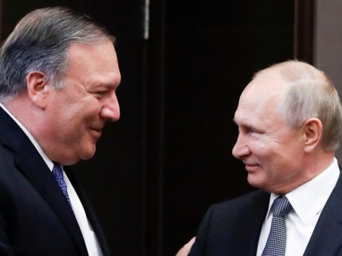 Russian President Vladimir Putin and U.S. Secretary of State Mike Pompeo greet each other prior to their talks in the Black Sea resort city of Sochi