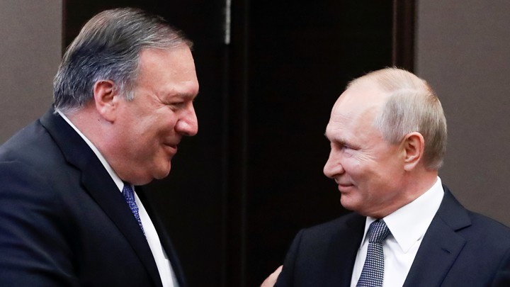 Russian President Vladimir Putin and U.S. Secretary of State Mike Pompeo greet each other prior to their talks in the Black Sea resort city of Sochi